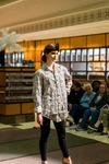 Model Poses on the Runway Wearing a Black and Gold Button-Down Shirt by Mississippi State University Libraries