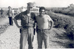 Soldier and worker pose for picture