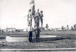 Sonny Montgomery and unidentified soldier in front of memorial