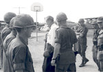 Sonny Montgomery passing a group of soldiers