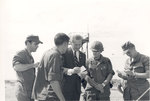 Sonny Montgomery reads mail with 4 unidentified soldiers