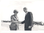 Sonny Montgomery shakes hands with unidentified soldier