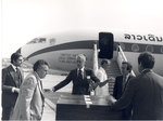 Sonny Montgomery talks with 4 men in front of United Nations plane