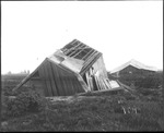 Two Damaged Cabins by Mississippi Agriculture and Forestry Experiment Station. Delta Branch, Stoneville