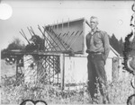 Man With Equipment by Mississippi Agriculture and Forestry Experiment Station. Delta Branch, Stoneville