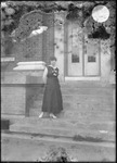 Woman on Steps by Mississippi Agriculture and Forestry Experiment Station. Delta Branch, Stoneville