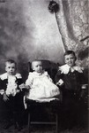 Three Children in Period Clothing