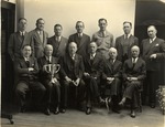 Rex F. Reed Holding the Jersey Bulletin Accomplishment Cup Among American Jersey Cattle Club Members and Officials