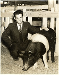 A man and his hog by Charles Johnson Faulk Jr.