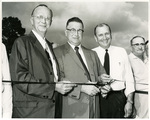 W. F. Dearman (left), John D. Smith (second left) and Roy Adams (second right). by Charles Johnson Faulk Jr.