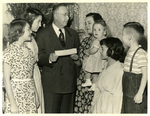 Louis P. Cashman and unidentified woman and children by Charles Johnson Faulk Jr.
