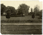 House on railroad tracks