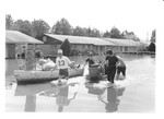 4 men removing belongings from flooded homes, Tombigbee River Flood 1974.