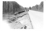 Truck off road and flood damage to road shoulder - Tombigbee River Flood 1974.