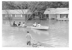 Rescue worker in boats near flooded houses - Tombigbee River flood 1974