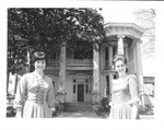 Two tour guides in front of Merrehope house