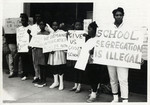 Children and adults picketing for school integration in West Point.