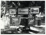 Group of paintings by Robert Graves at outdoor show