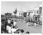 Parade down Main Street, North corner of Lafayette to Washington Street, North side of Main. Courthouse with clock tower in background. MSU Band in foreground