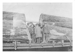Four Men with Logs