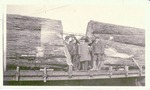 Four Men with Logs