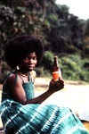 Liberian Woman Holding a Liberian Club Beer by Jerry Boyd Jones