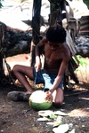Boy Opening a Coconut by Jerry Boyd Jones