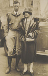 Man and Woman in Front of a Car