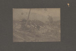 People Standing Among Tornado Debris