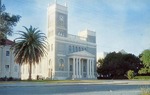 Angle View of Our Lady of the Gulf Catholic Church With a Palm Tree To the Left of the Clock Tower, Bay St. Louis, Mississippi