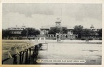 Waterfront view of St. Stanislaus College with a Pier, Beach, and Antenna Tower in Front, Bay St. Louis, Mississippi