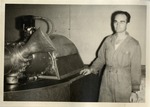 Man in Coveralls Next to a Machine