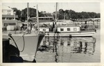 Two Masted Schooner and a Boat Docked at a Pier