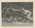 United States Air Force Airmen in Uniform Inspecting A Cannon
