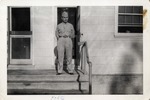 United States Air Force Airman in Uniform Standing on a Porch