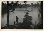 A Man Standing on the Bank of a Body of Water