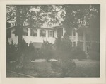 House with Awnings and Landscaping