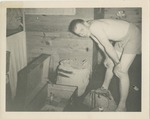 Man in Bunkroom With Luggage
