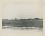 B-24 Airplane Taking Off From Runway of Grassy Airfield