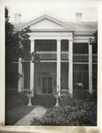 Two Story House with Columns, Railings, and Trees