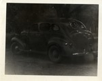 Mid-Twentieth Century Car In Front of Trees