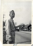 United States Airman in Uniform Standing on the Side of a Street