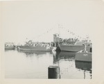 Group of Boats Docked and Strung with Flags