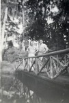 United States Air Force Airmen Standing on a Wooden Foot Bridge