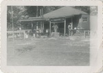 Men Cooking On the Porch of an Old House or Shed