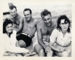 Three Men and Two Women On a Boat Out On the Water