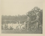 Men on Bicycles Staring at a Pond
