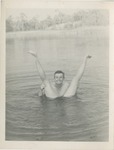 Man Holding Legs in the Water