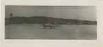 United States Air Force Airplane on the Airfield With the Hangars and Water tower in View