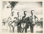 Four Men in Swim Trunks at the Beach
